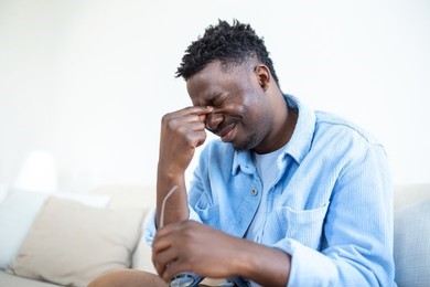 african-man-glasses-rubs-his-260nw-2228931575